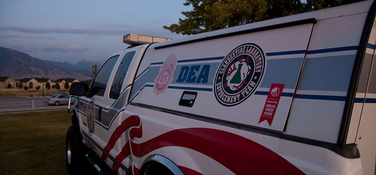 A police truck with the DEA insignia.