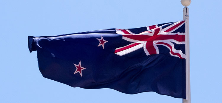 The Australian flag flying on a windy day.