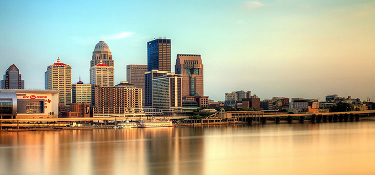 View of Louisville, Kentucky at dusk from across water.