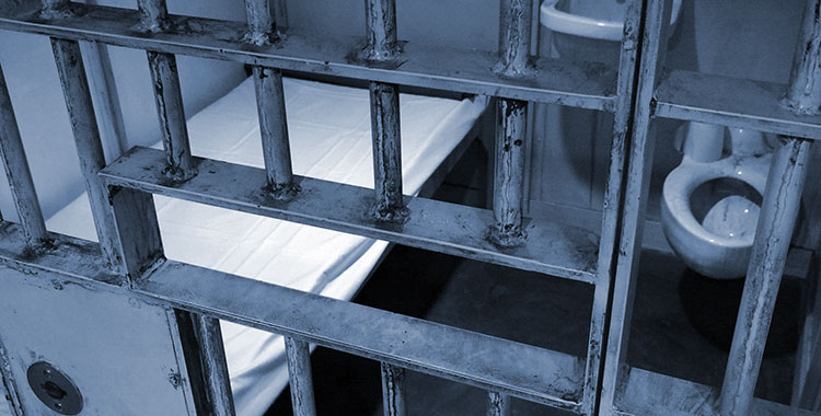 Image depicting the inside of a high security prison cell.