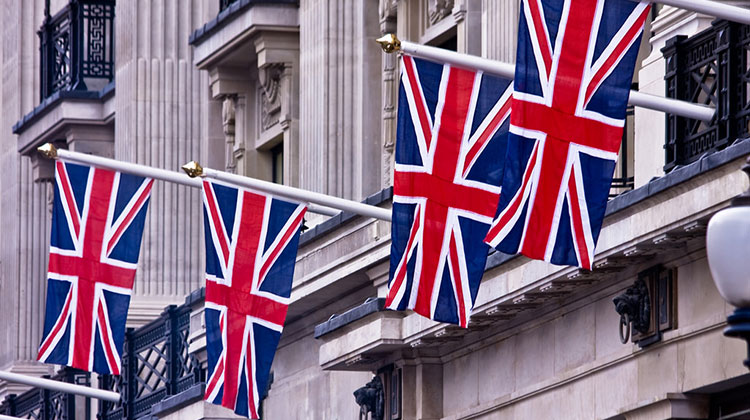 A row of four United Kingdom flags, a.k.a. the Union Jack.