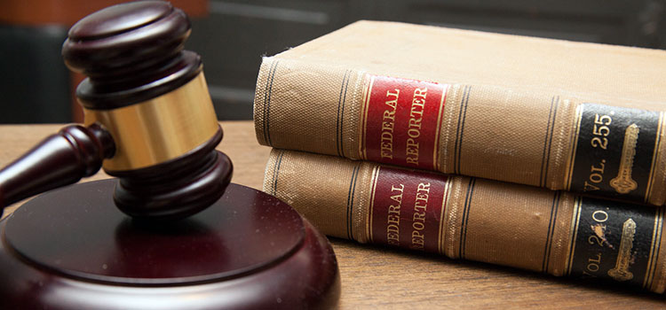 A judge's gavel on their courtroom desk.