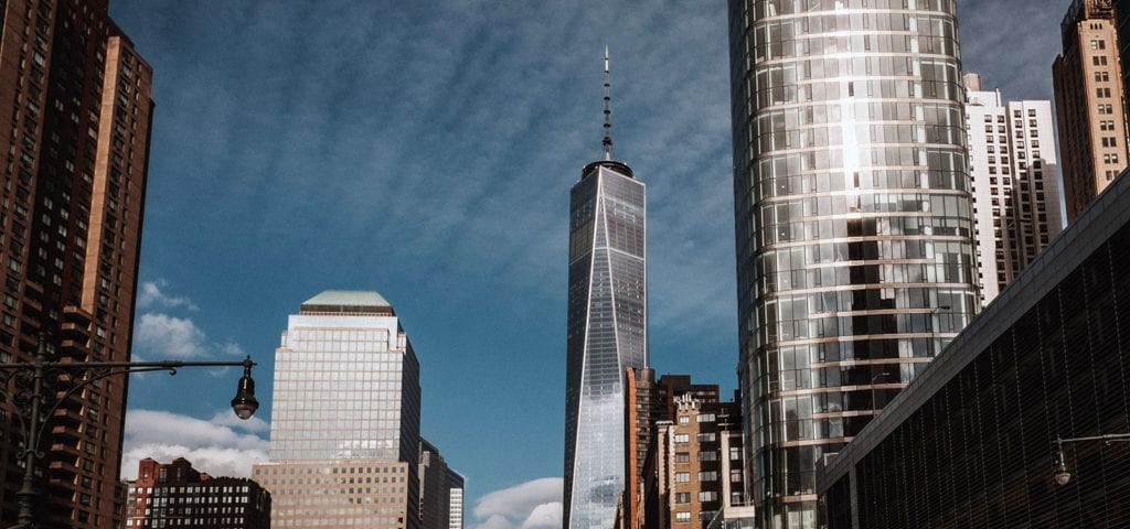 Looking up at the buildings of New York City from the street.