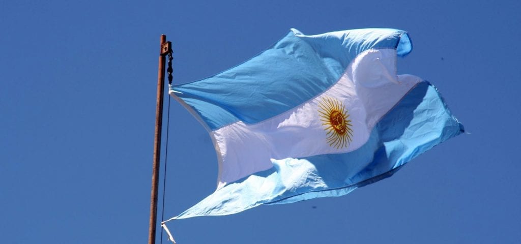 The flag of Argentina on a sunny, cloudless day.