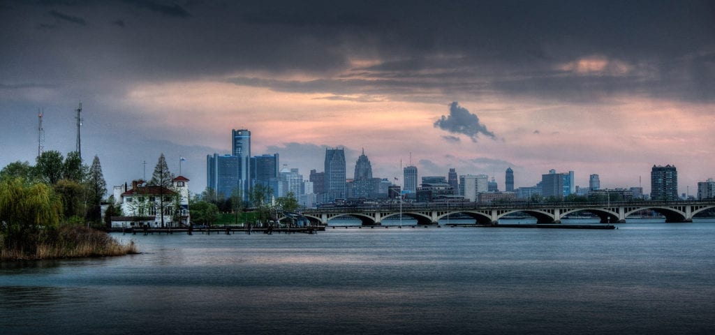 Detroit skyline with the MacArthur bridge leading to Belle Isle and Detroit Boat Club in the foreground. Photo taken from Belle Isle fishing pier.