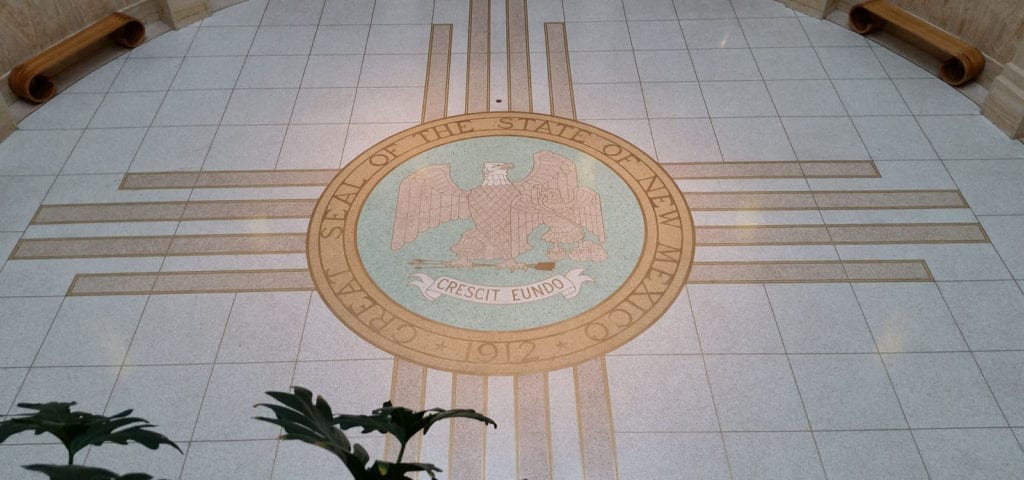 The official state seal of New Mexico, on the floor of the state's capitol building in Santa Fe.