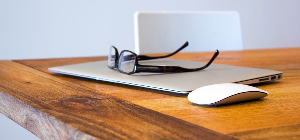 The life of a business entrepreneur: glasses, laptop, determination.