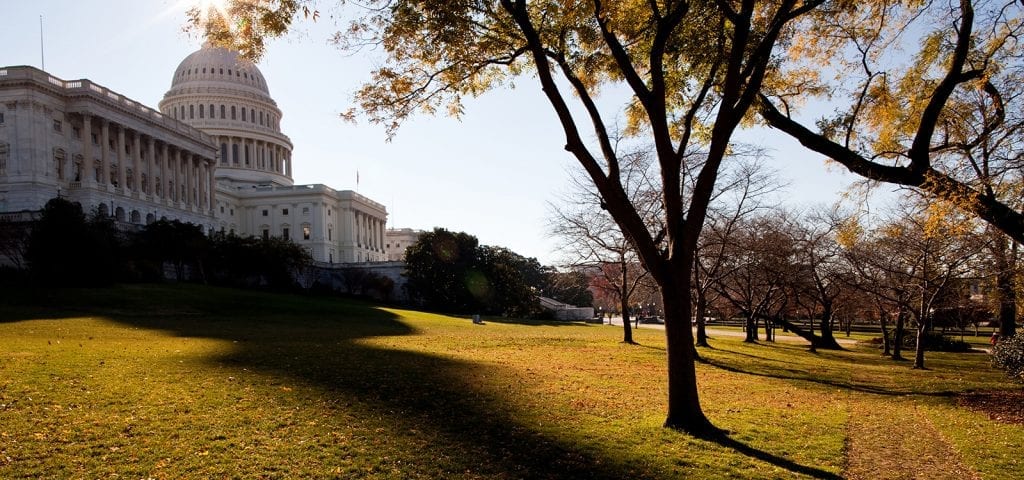 The U.S. Capitol Building in Washington D.C. on an autumn day.