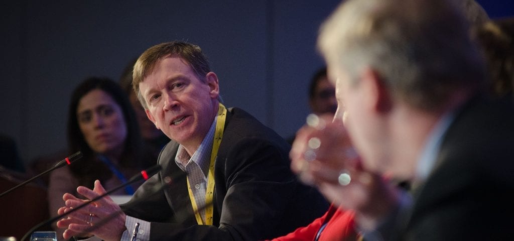 Colorado- Governor John Hickenlooper (center) talks with Agriculture Secretary Tom Vilsack (right) about how most Colorado schools have produce gardens to educate and supplement the schools nutrition program, during the National Governors Association Education, Early Childhood and Workforce Committee in Washington, D.C., on Sunday, Feb. 26, 2012. USDA Photo by Lance Cheung.