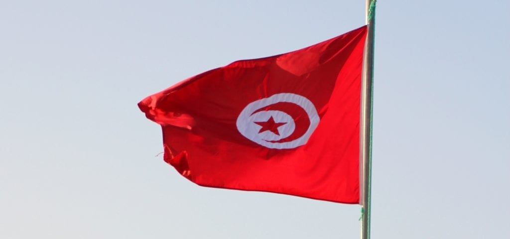 The national flag of Tunisia.