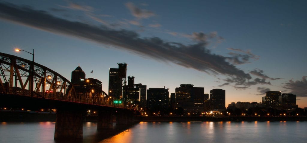 View of downtown Portland, Oregon and the Hawthorne bridge, from the east side of the Willamette River.