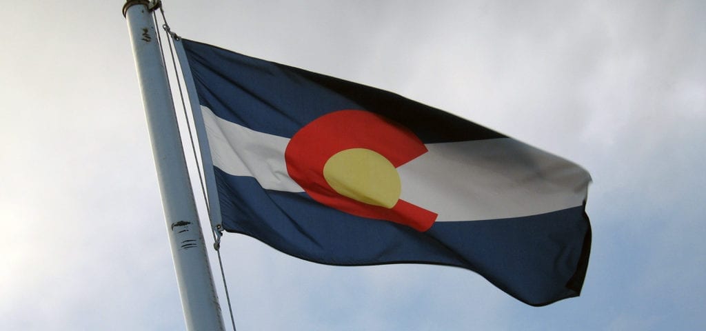 The state flag of Colorado flying in the wind.