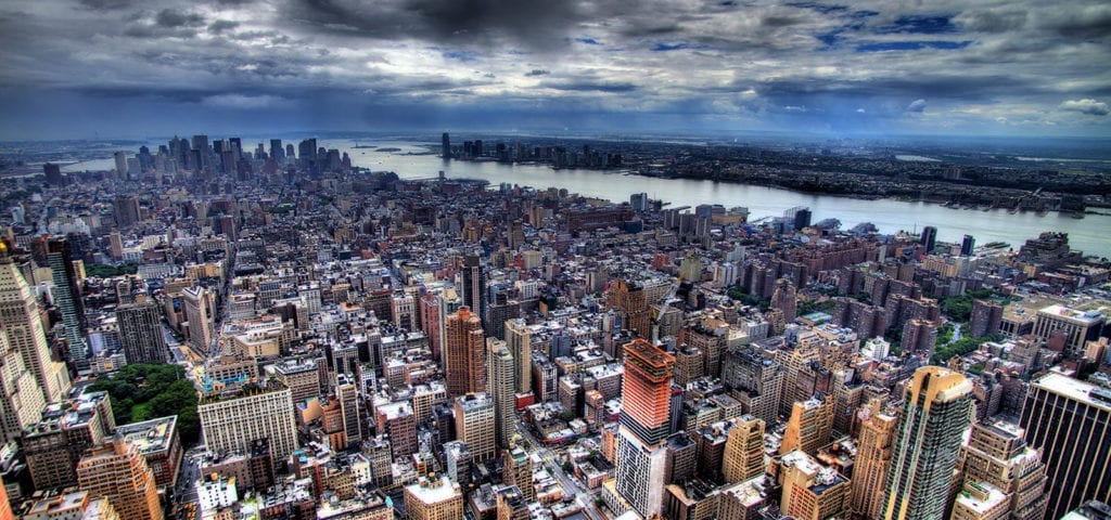 The New York City skyline viewed from atop a Manhattan skyscraper.