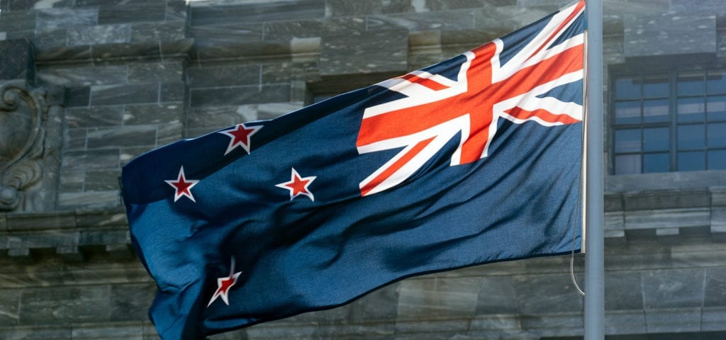 The flag of New Zealand flapping in the wind.