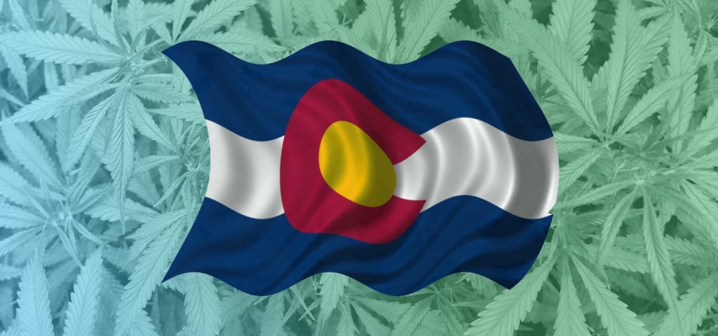 A graphic of the Colorado flag overlaid onto a picture of a commercial cannabis canopy.