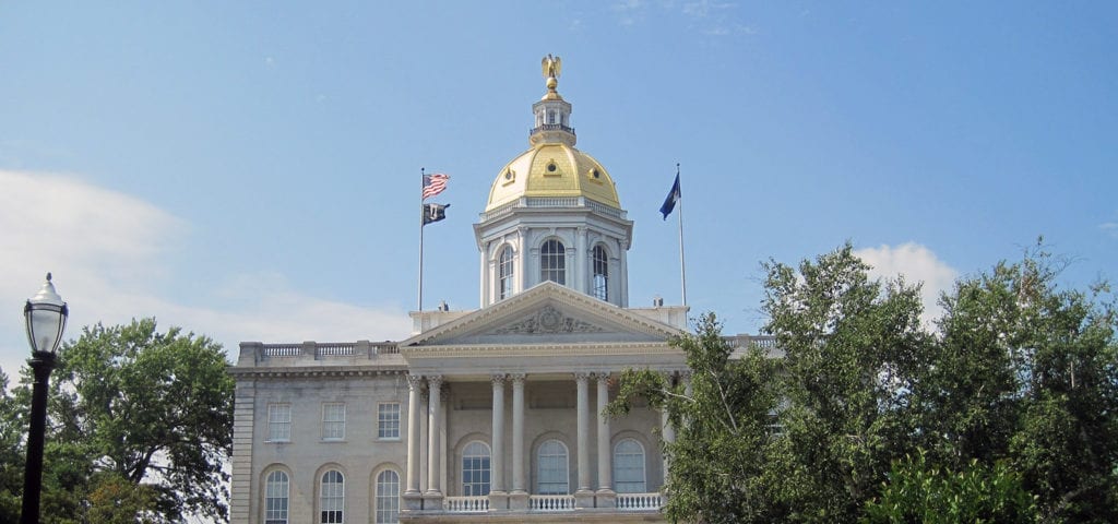 The New Hampshire Capitol Building on a sunny day in Concord, New Hampshire.