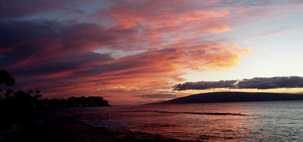 A brightly colored sunset off the coast of Hawaii.