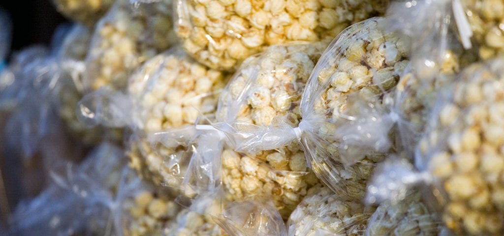 Plastic bags of kettle corn sit in a pile during an event at the Del Mar Fairgrounds near San Diego.