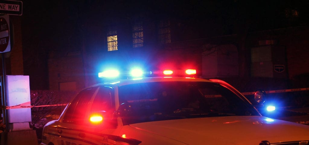 The blue and red lights on top of a police car.