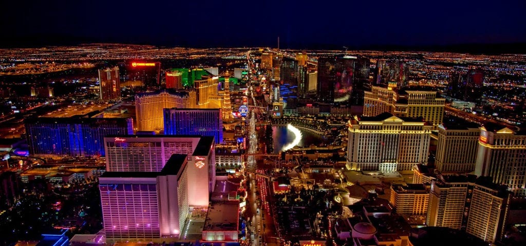 An aerial and nighttime view of the Las Vegas city skyline.