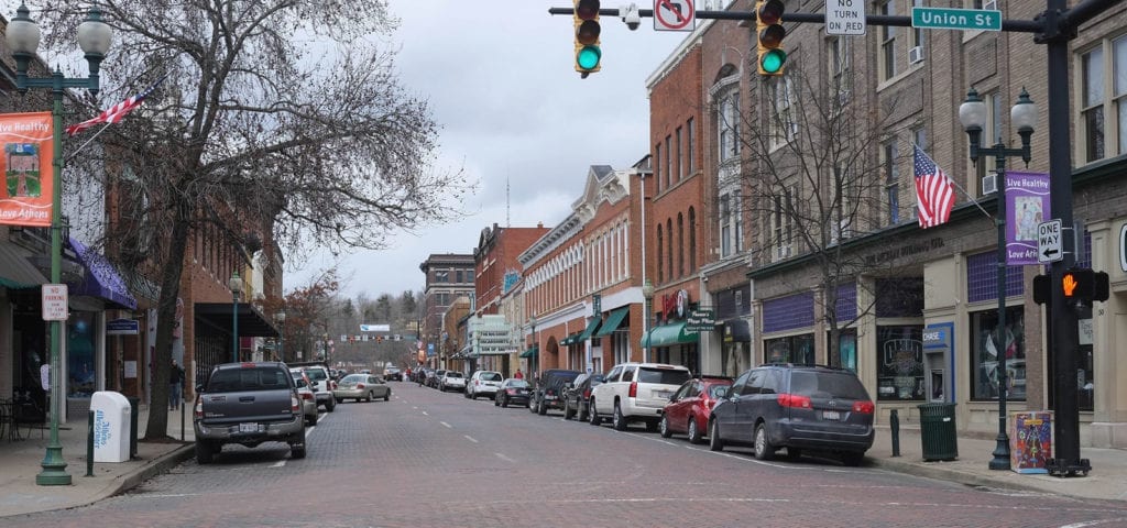 Cars on a downtown street in Athens,, Ohio.