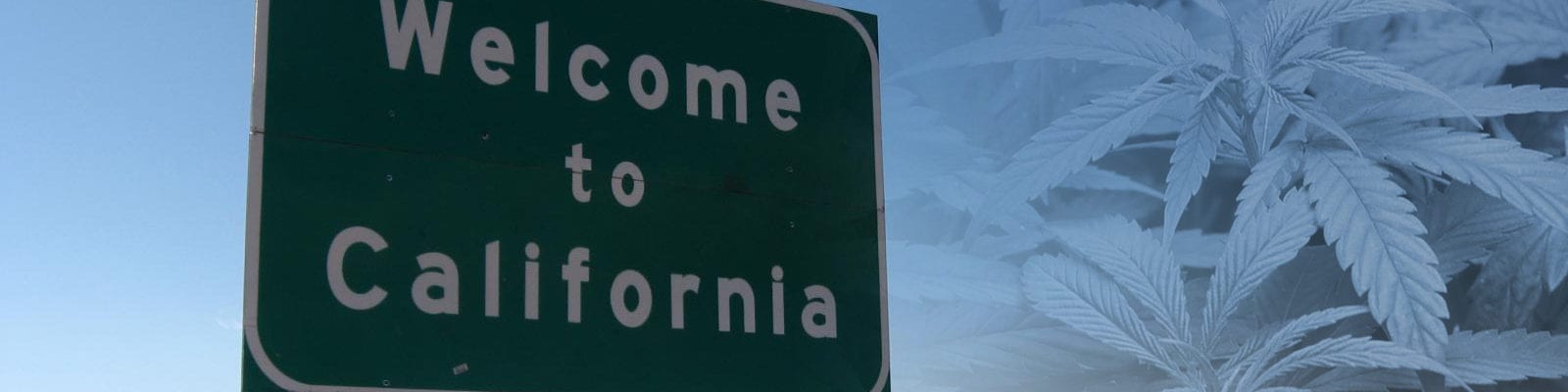 A roadside highway sign welcoming drivers to the state of California.
