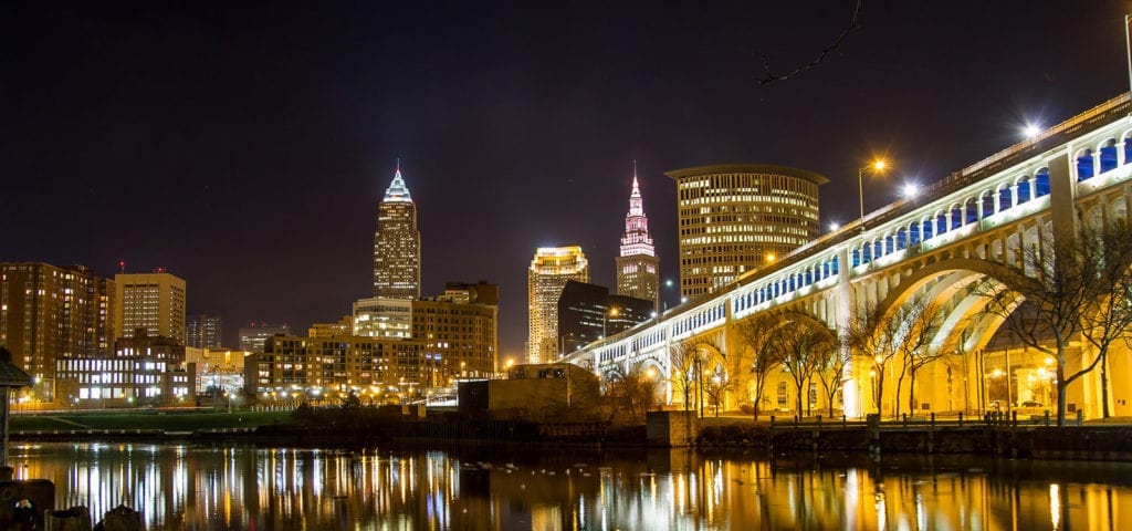 Nighttime photo of Cleveland, Ohio and the lights reflecting off the river.