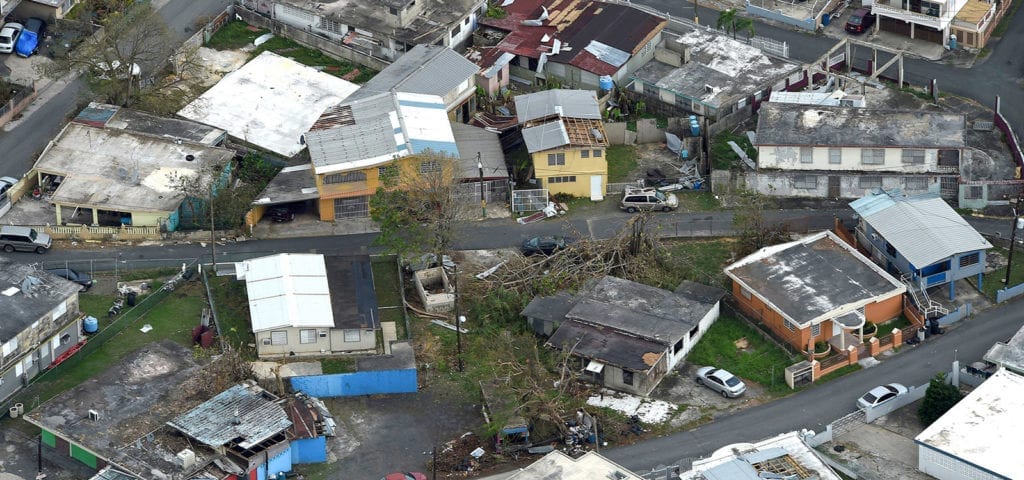 An aerial image of damaged homes and communities in the destructive path Hurricane Maria.
