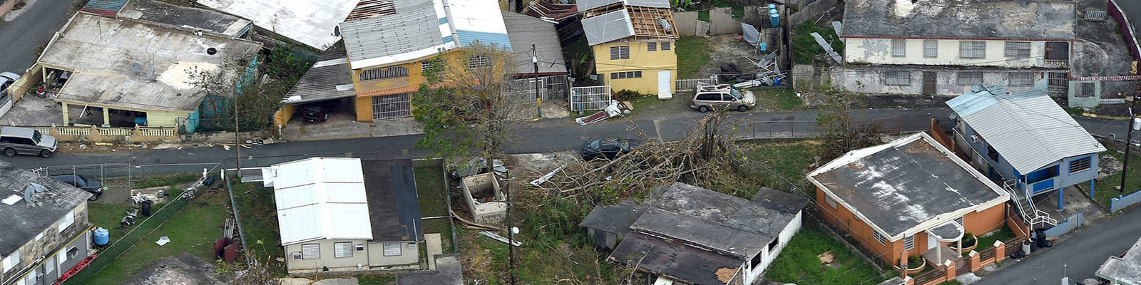 An aerial image of damaged homes and communities in the destructive path Hurricane Maria.