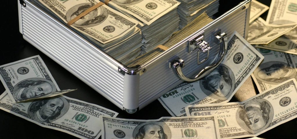 A metal suitcase stuffed with $100 bills.