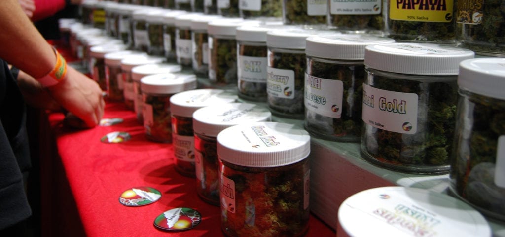 Product samples lined up on a table at the Emerald Cup 2016 in California.