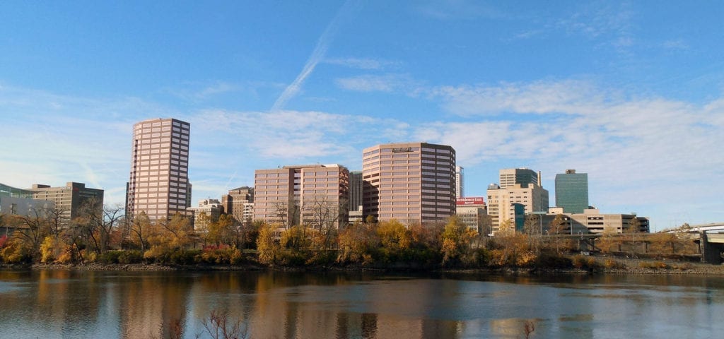 Photograph of buildings in Hartford, Connecticut from across a wide river.