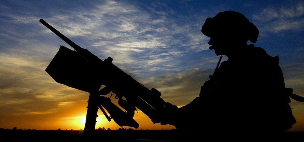 A US Army (USA) Soldier assigned to the 1st Infantry Division, mans a .50 caliber M2HB machine gun