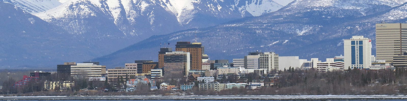 Downtown Anchorage, Alaska photographed from a boat several hundred meters from the shore.