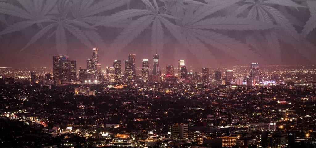 The night skyline of Los Angeles, California in a digital collage with a black and white picture of cannabis foliage.