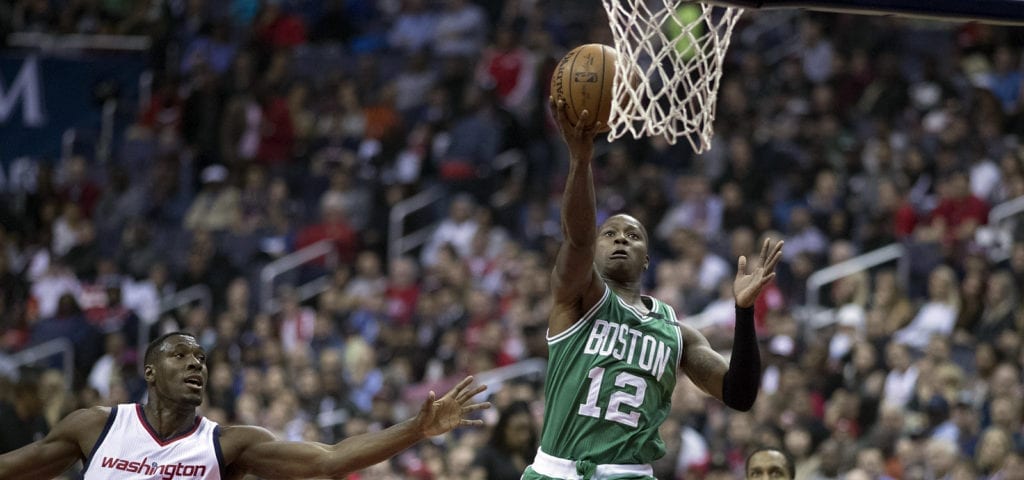 Terry Rozier, an NBA player for Boston, jumps up for a 2-point layup.