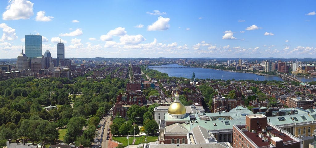 Photo of the Boston city skyline on a clear, sunny day.