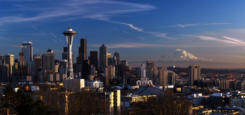 Photograph of downtown Seattle with Mt. Rainier in the background.