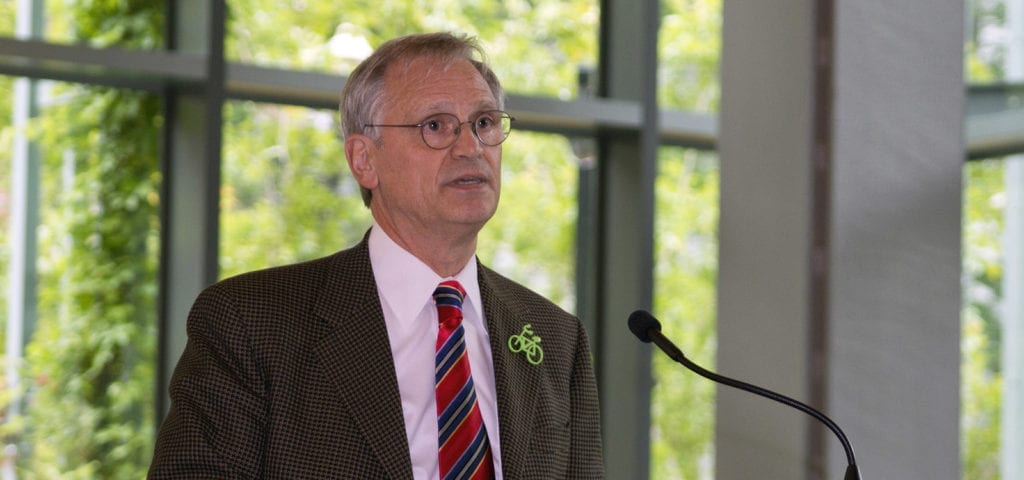 Oregon Rep. Earl Blumenauer with a green, bicycle pin on his coat.