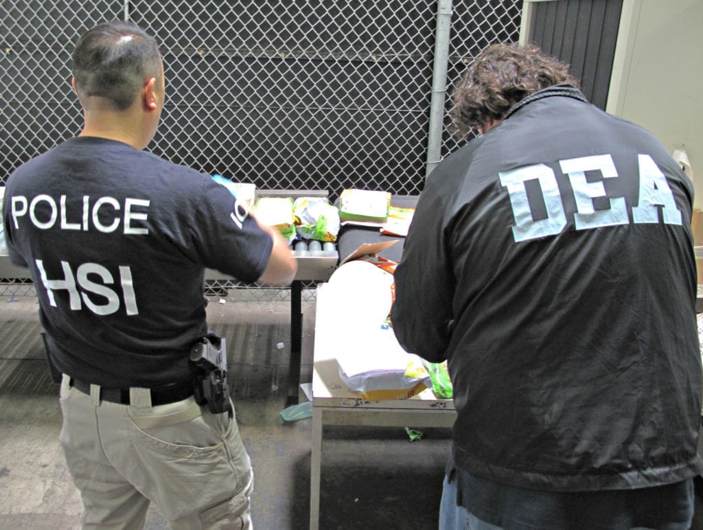 101315: Synergy III – 0006: DEA investigator teams up with ICE agent during Project Synergy III in Los Angeles, October 13, 2014. 