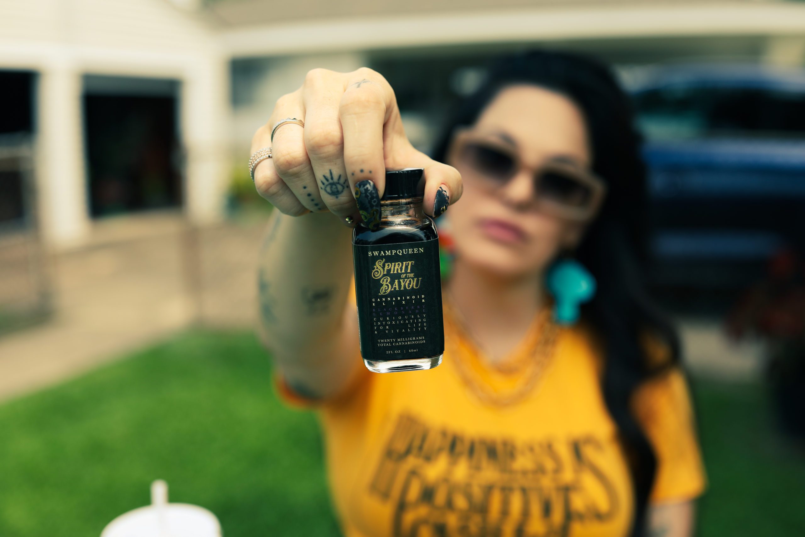 Olivia Alexander holds cannabinoid elixir